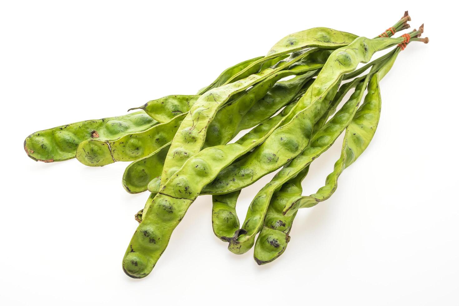A bunch of green beans with black spots on them photo