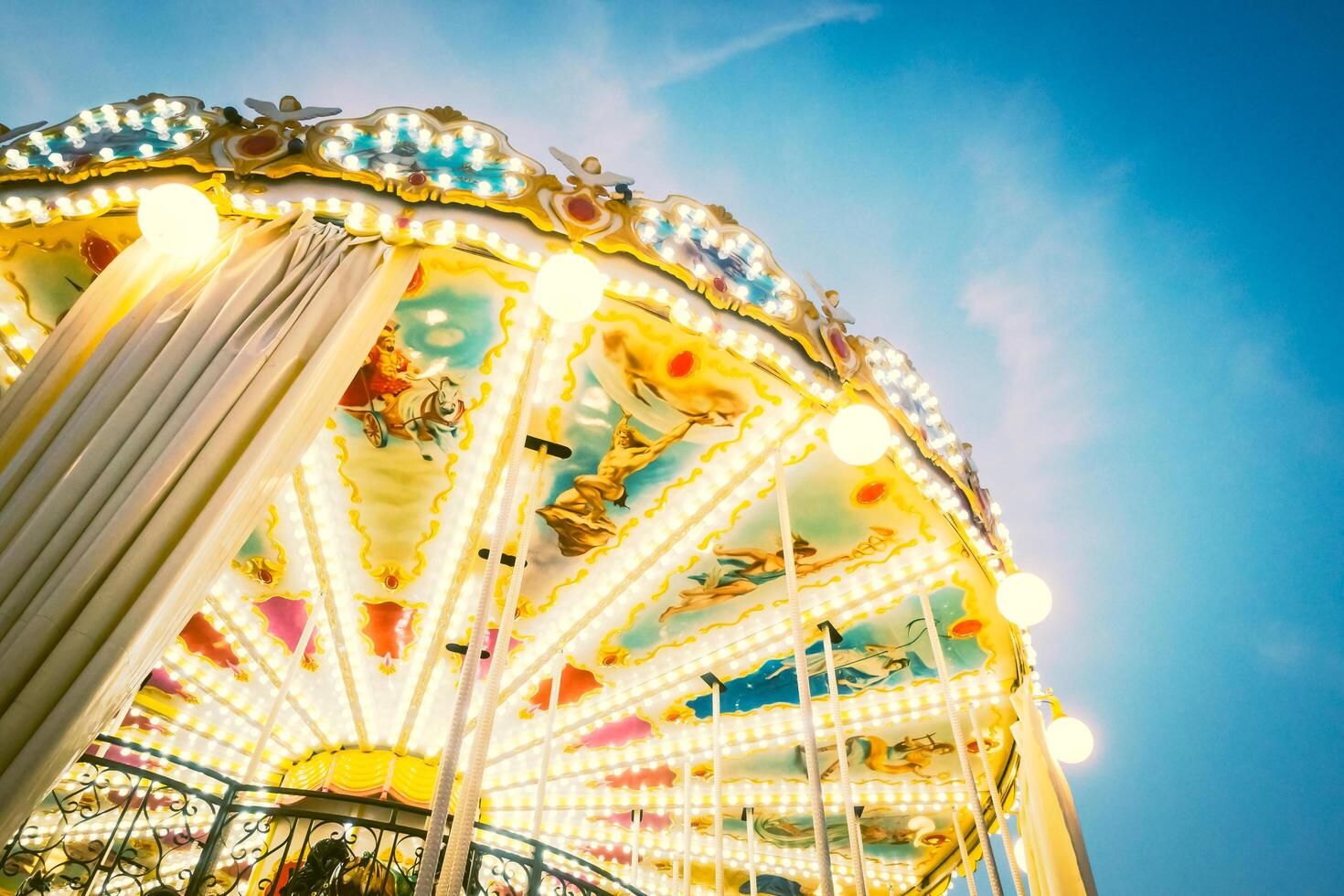 A carousel ride with lights on it photo