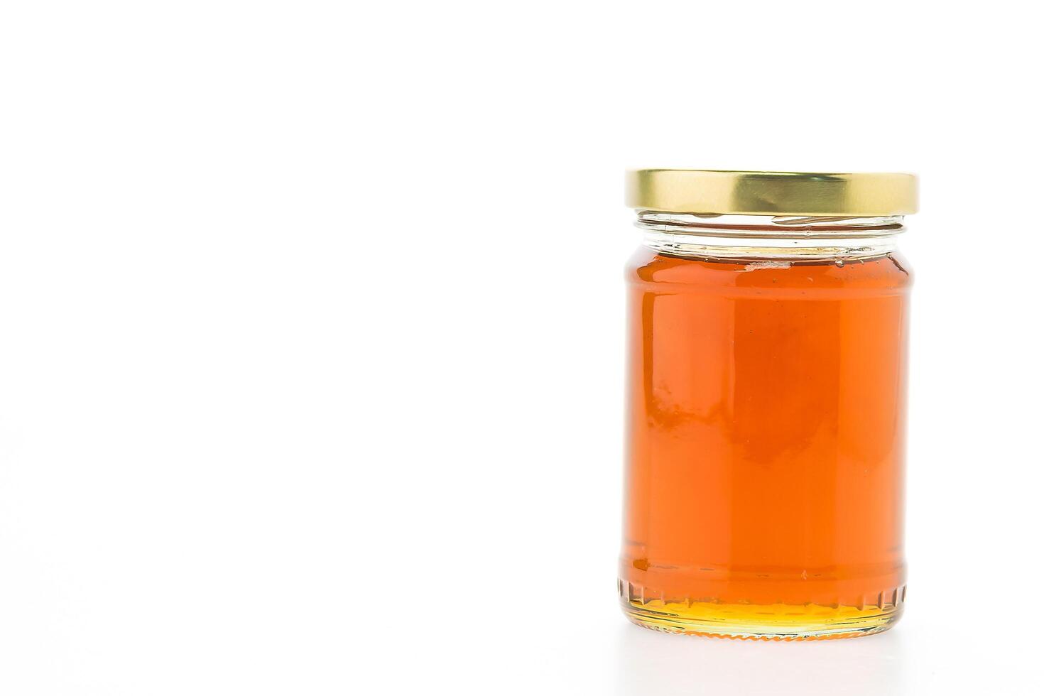 A jar of honey on a white background photo