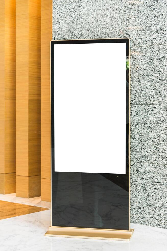 A large blank screen in front of a wall photo