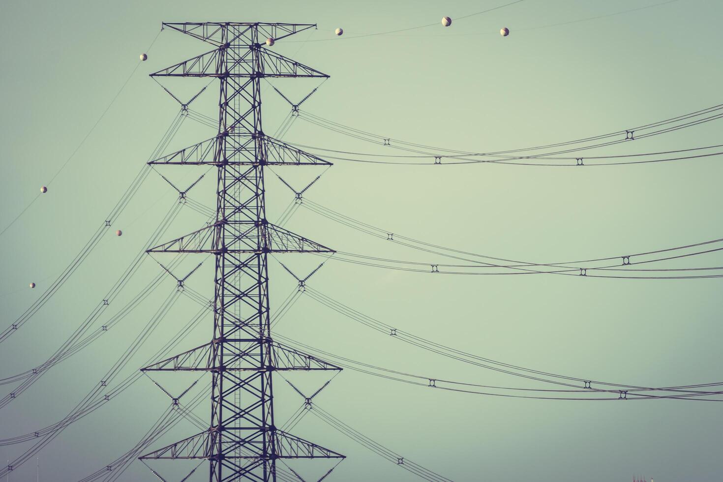 A large electric power line with many wires photo