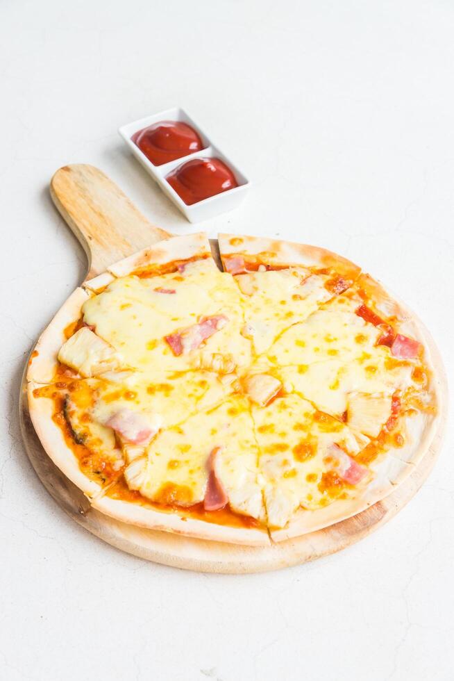 A pizza on a wooden board photo