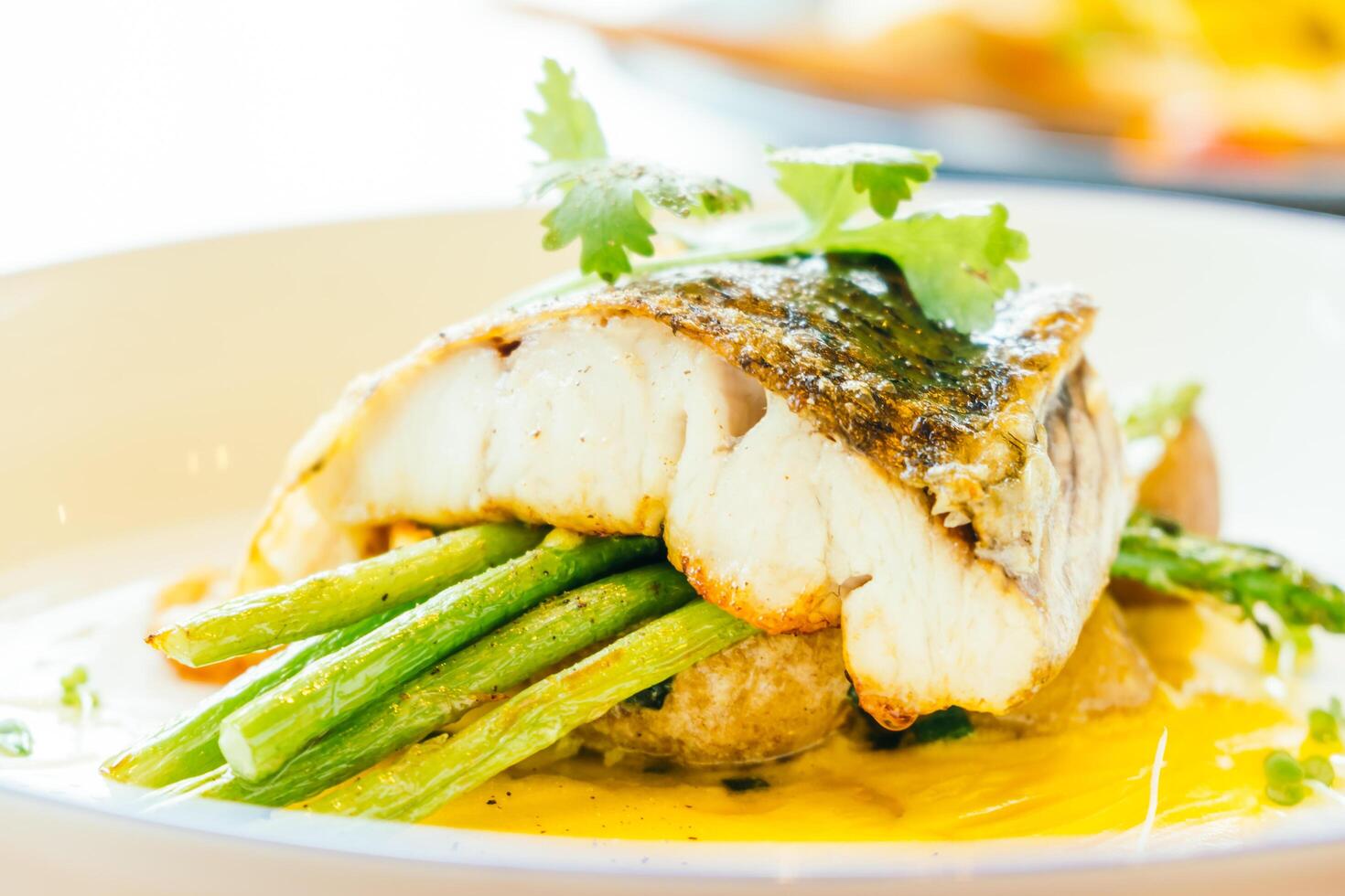 A plate of food with a fish on it photo