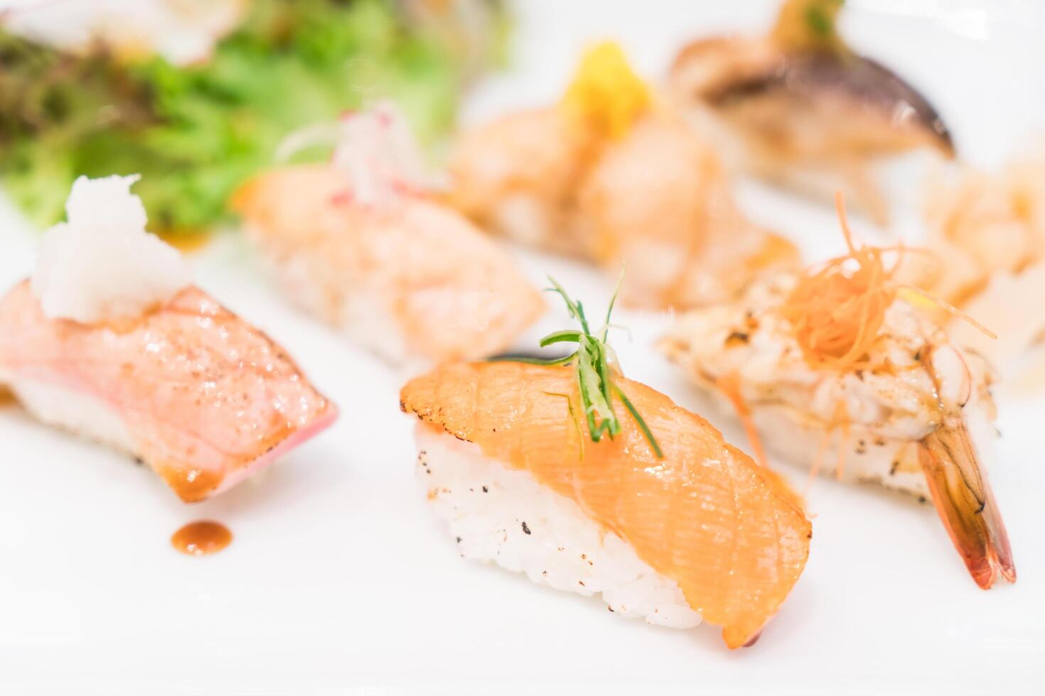 A plate of sushi with various types of fish photo