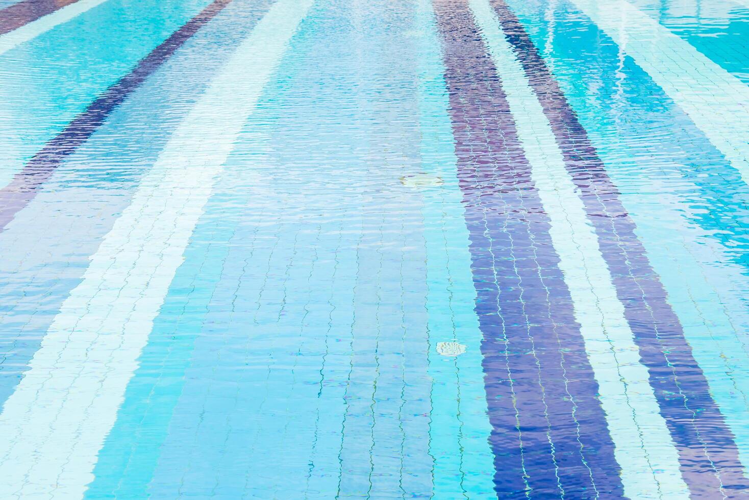 A swimming pool with blue and purple stripes photo
