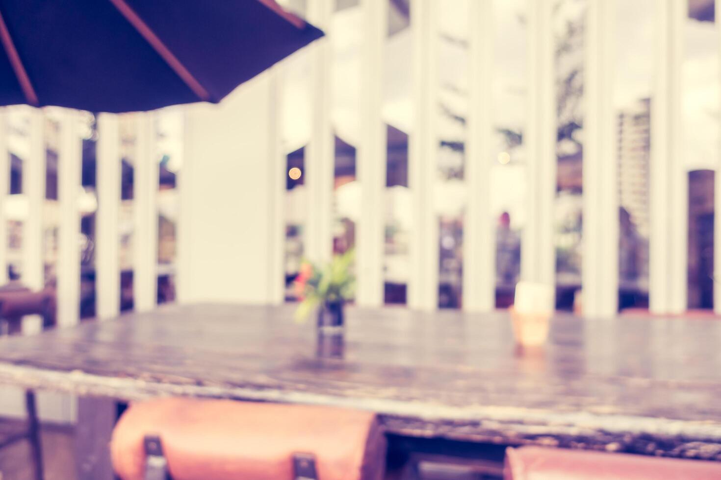 A table with chairs and an umbrella photo