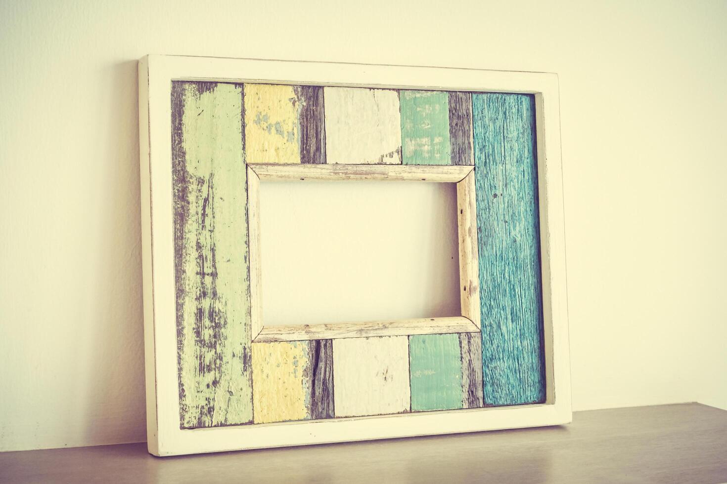 A wooden frame with a colorful paint on it photo