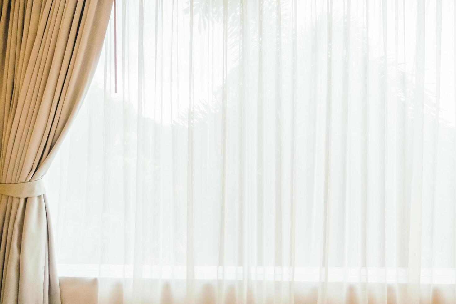 A window with curtains and a curtain photo