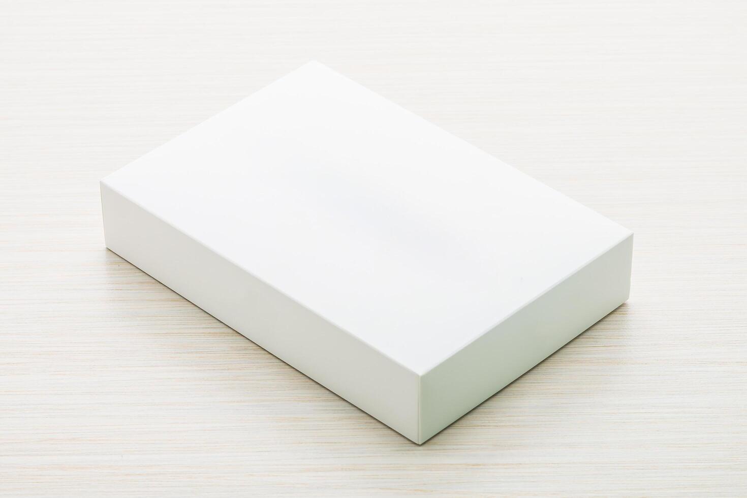 White box on a wooden surface photo