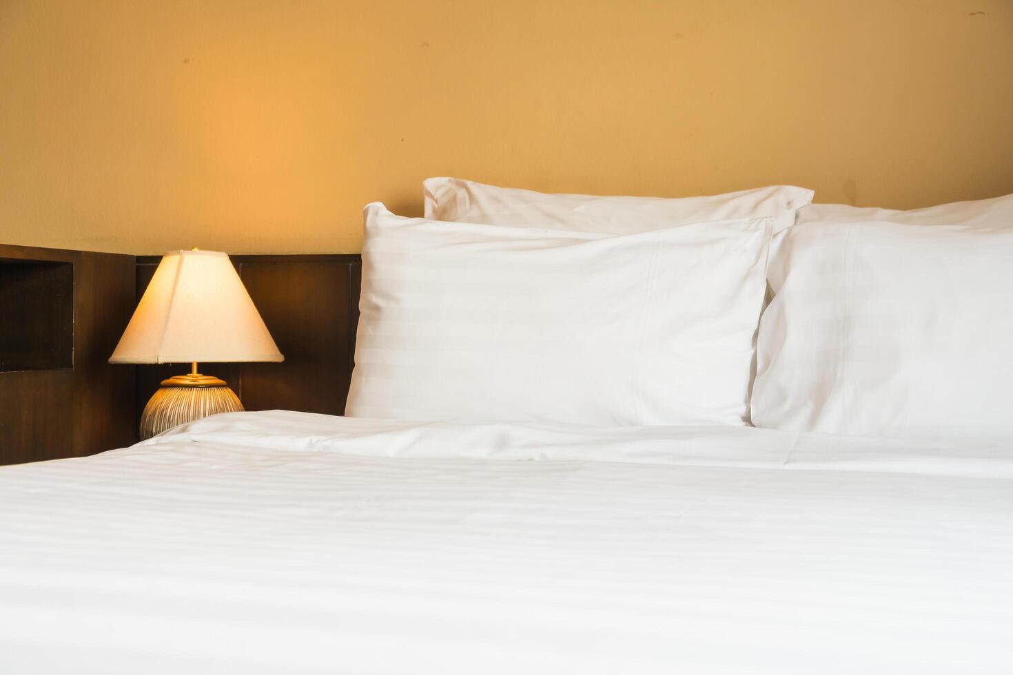 White bedspread on the bed photo