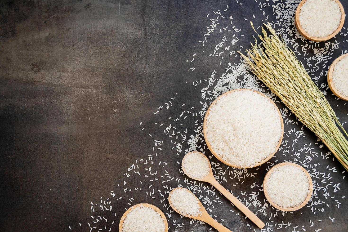 Various types of rice are shown on a table photo