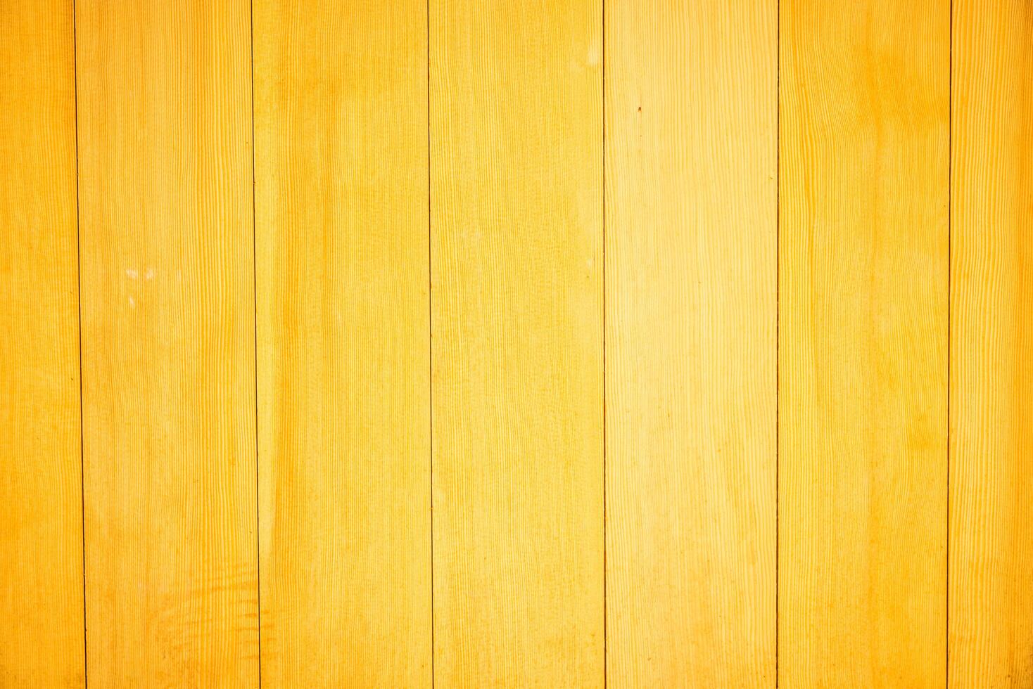 Yellow wooden wall background with wooden planks photo