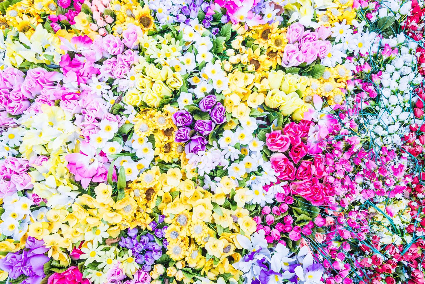A flower arrangement with many different colors photo