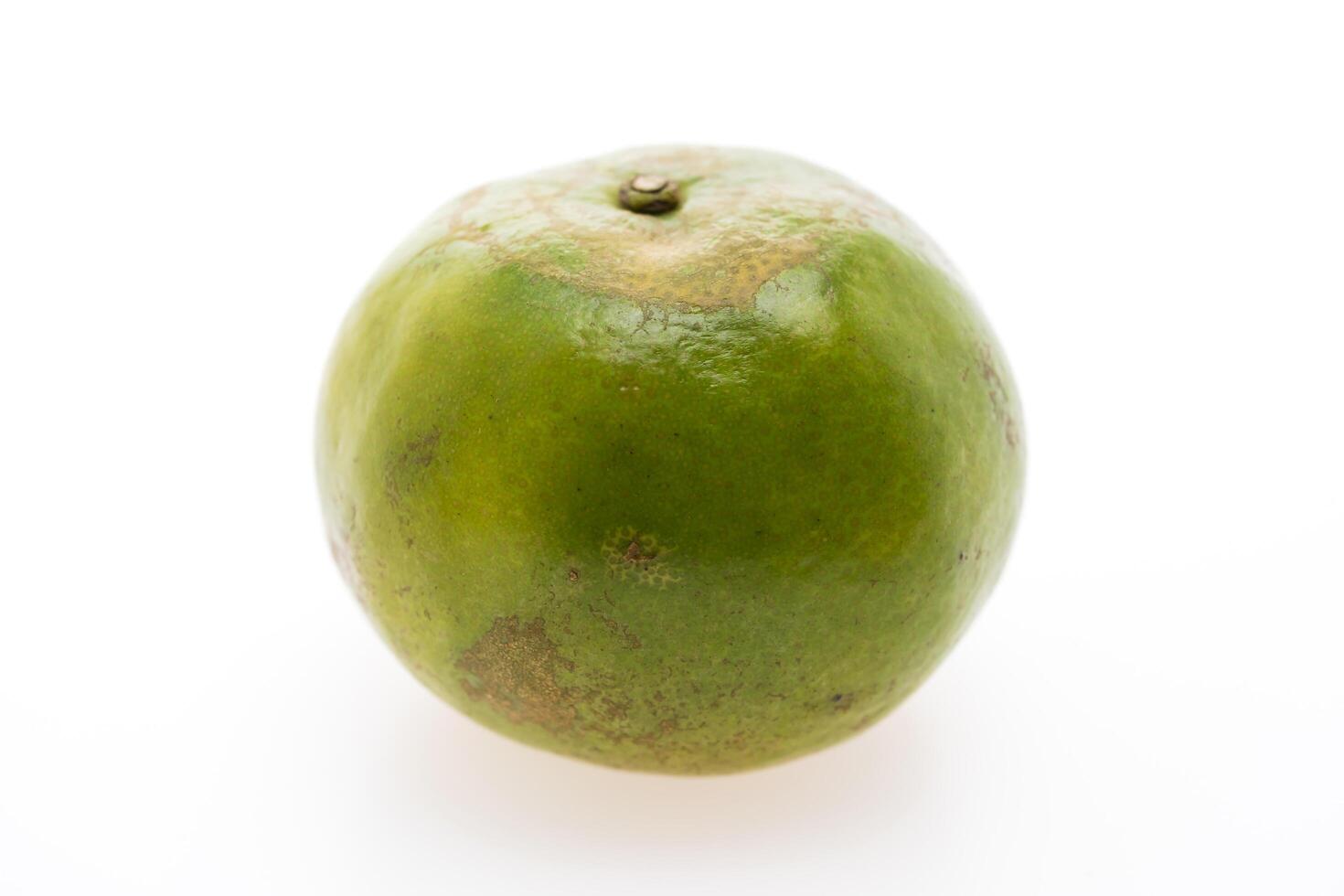 A green fruit on a white background photo