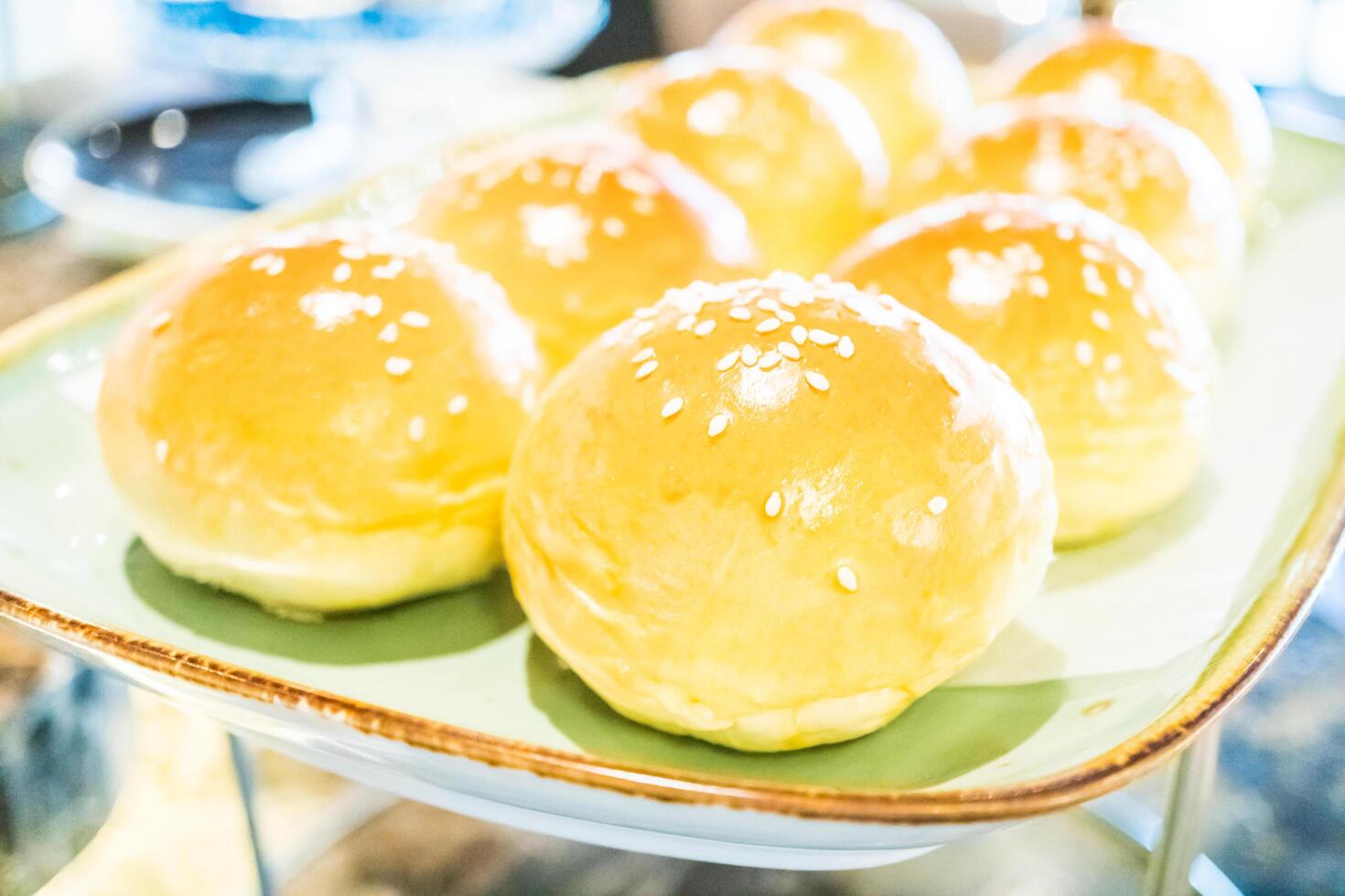 A tray of buns on a table photo