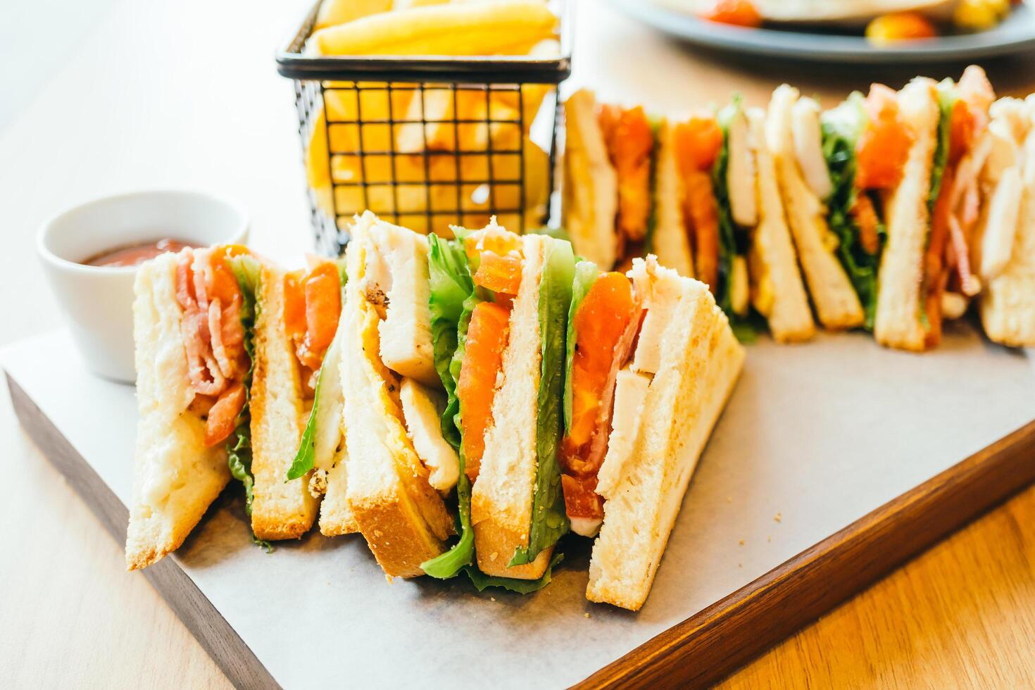 A tray with sandwiches and fries on it photo