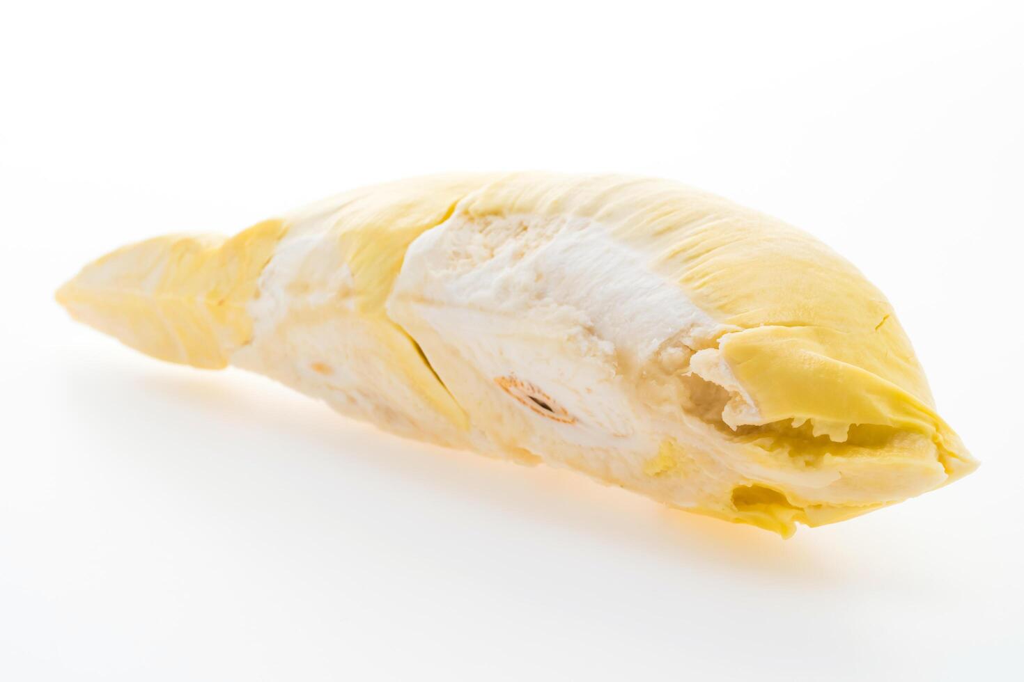 A peeled yellow fruit on a white background photo