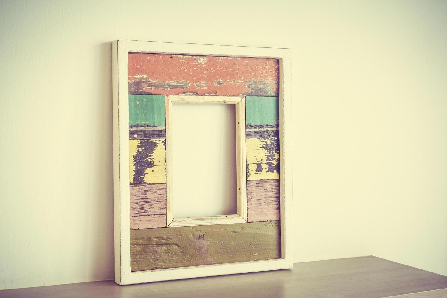 A wooden frame with a colorful paint on it photo