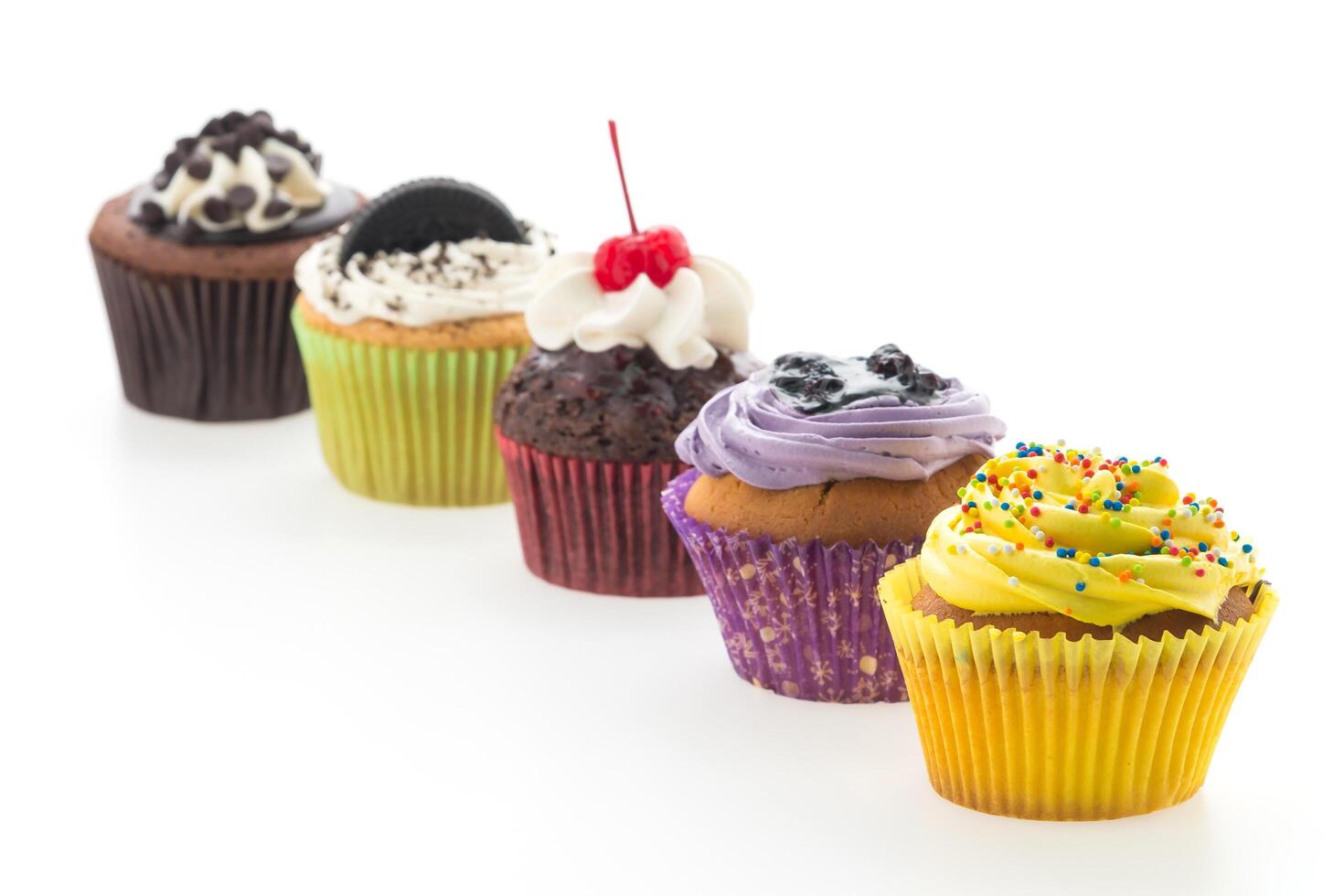 A row of cupcakes with different flavors photo
