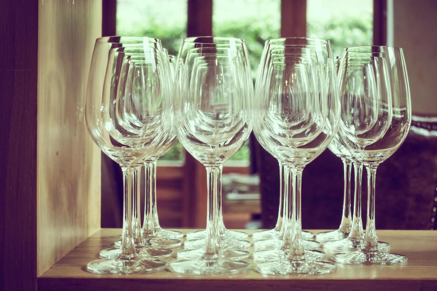 A row of empty wine glasses on a table photo