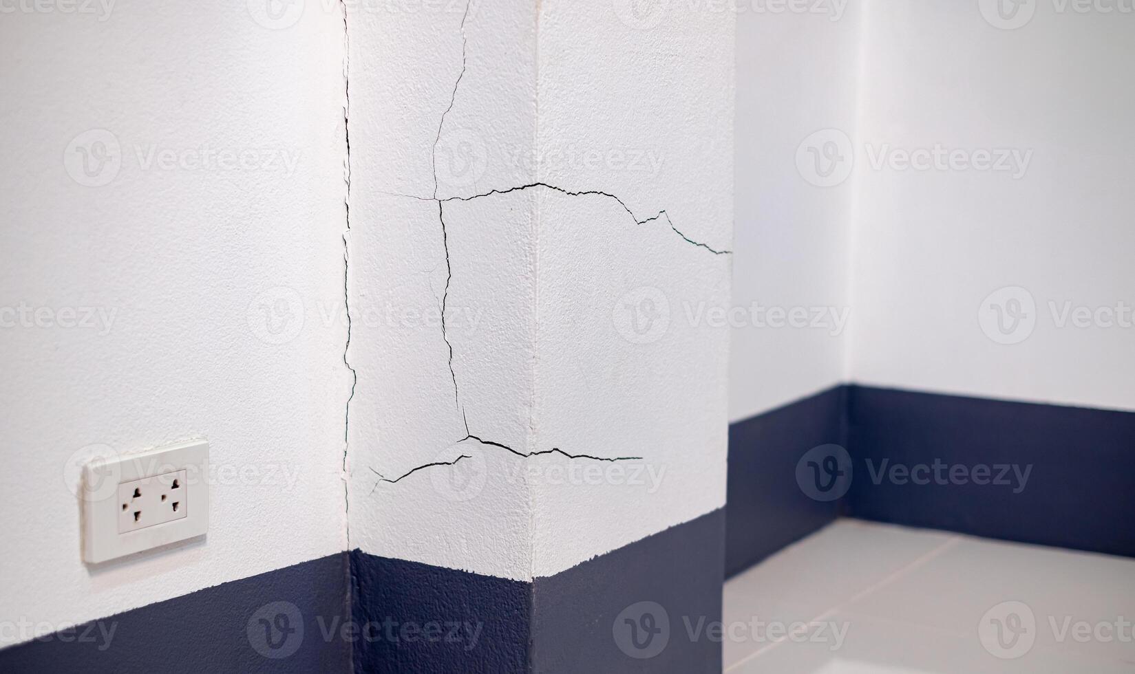 Wall Cracked, Concrete wall broken inside house, cement corner that effected with earthquake or collapsed ground, Construction problems from using poor quality materials or substandard craftsmanship photo