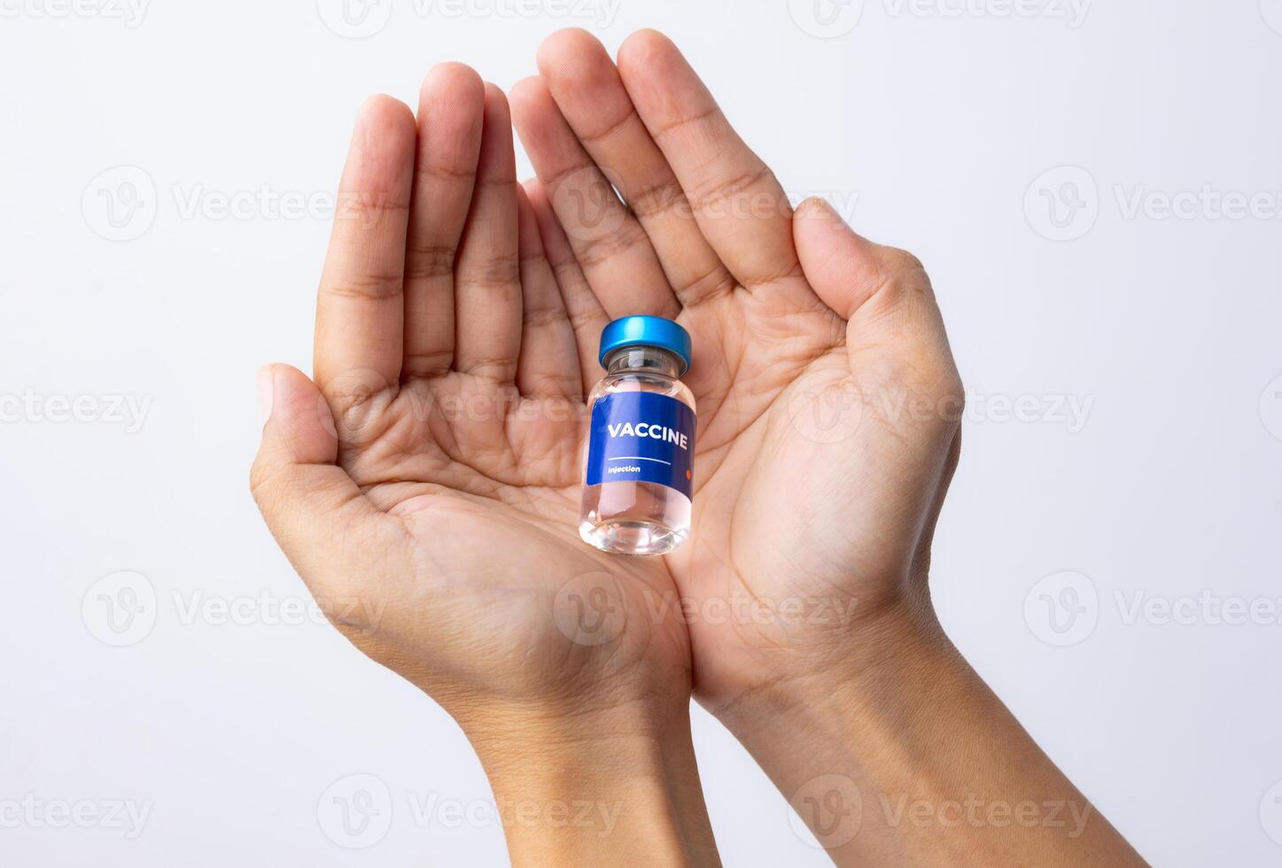Hands holding a vaccine, medicine liquid, health and medical concepts photo