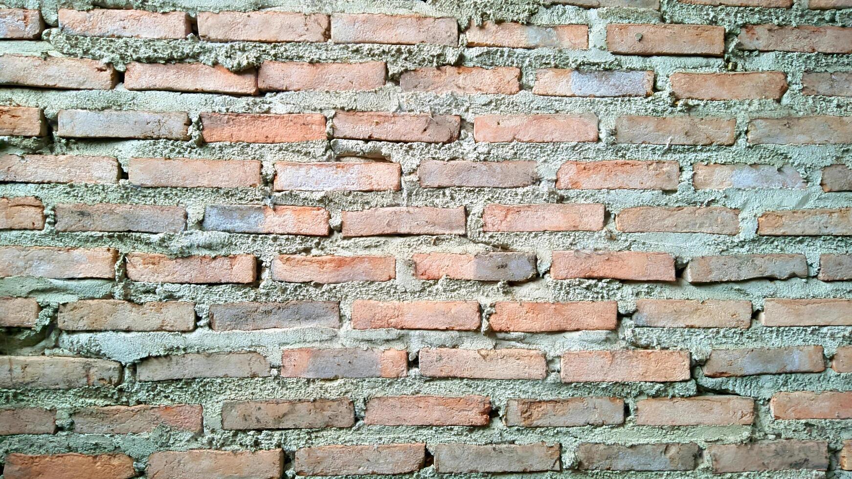 Rough red brick wall texture background. Perfect for construction, industrial, or rustic designs. photo