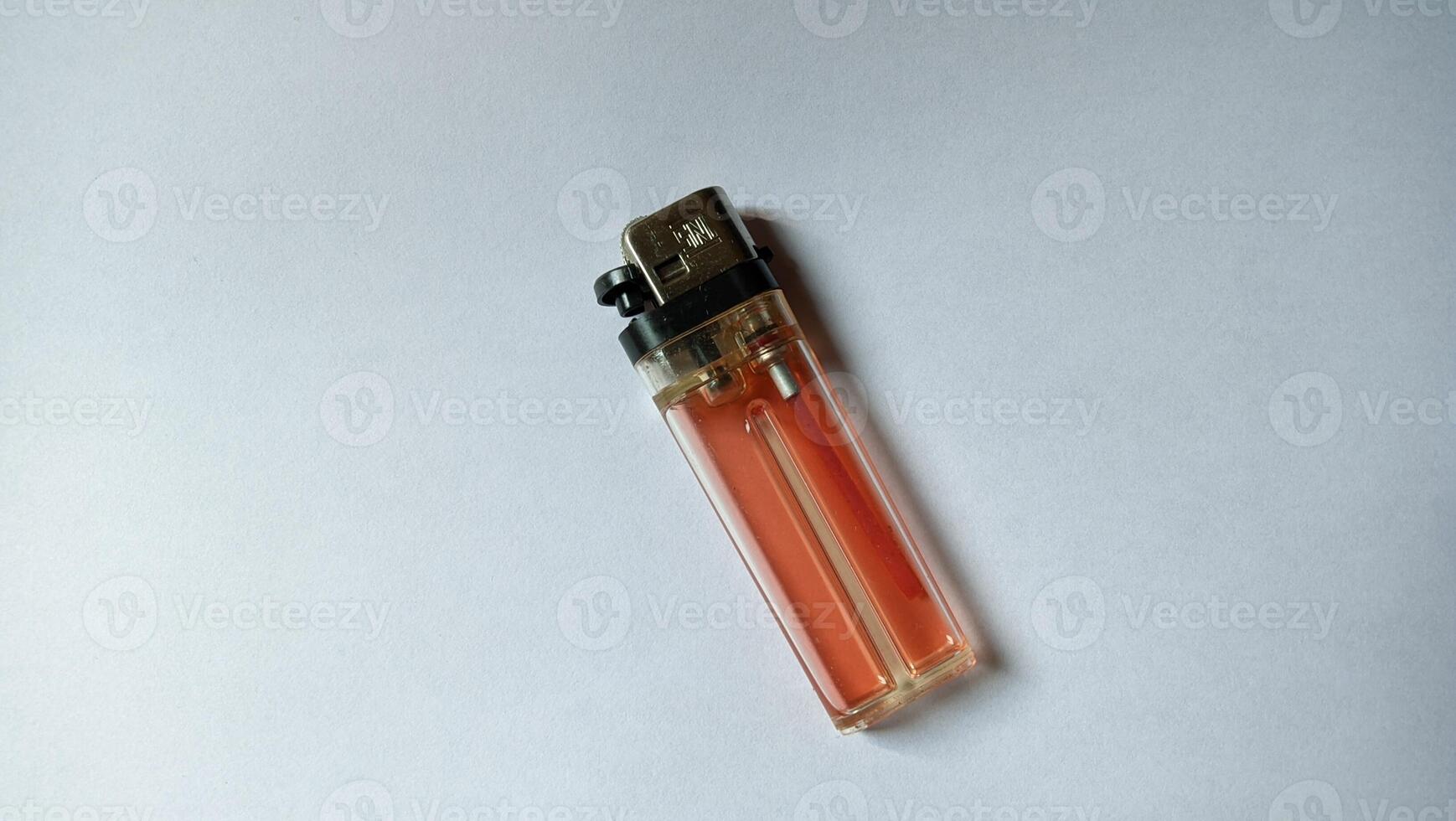 Disposable lighter on white background photo
