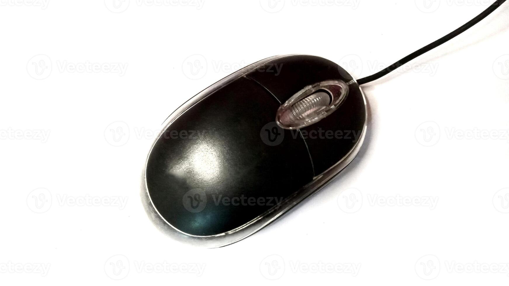 Close up of a black wired computer mouse isolated on white. Technology, computing, input device concept. photo