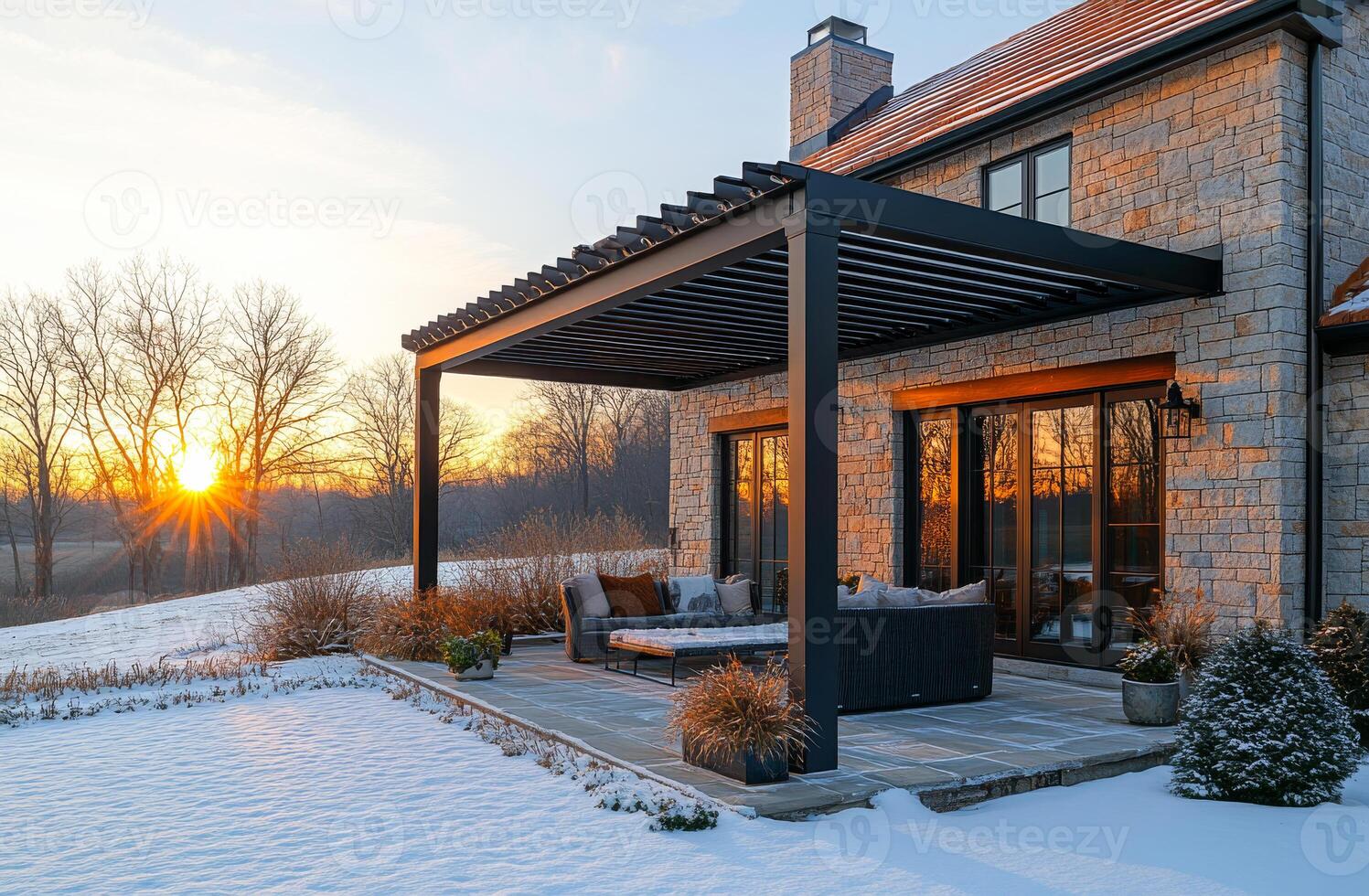 A house with a large patio and a gazebo. The patio is covered with snow and the gazebo is empty photo