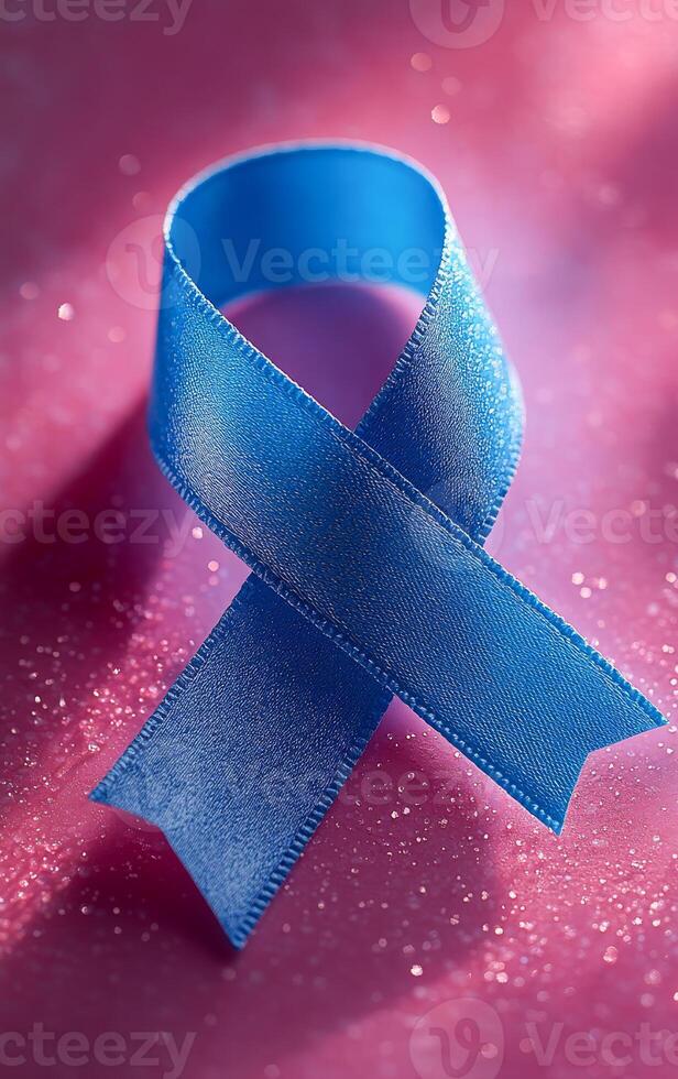 Blue ribbon shows support and awareness. A blue ribbon rests on a sparkling pink surface, symbolizing awareness and support for various causes. photo