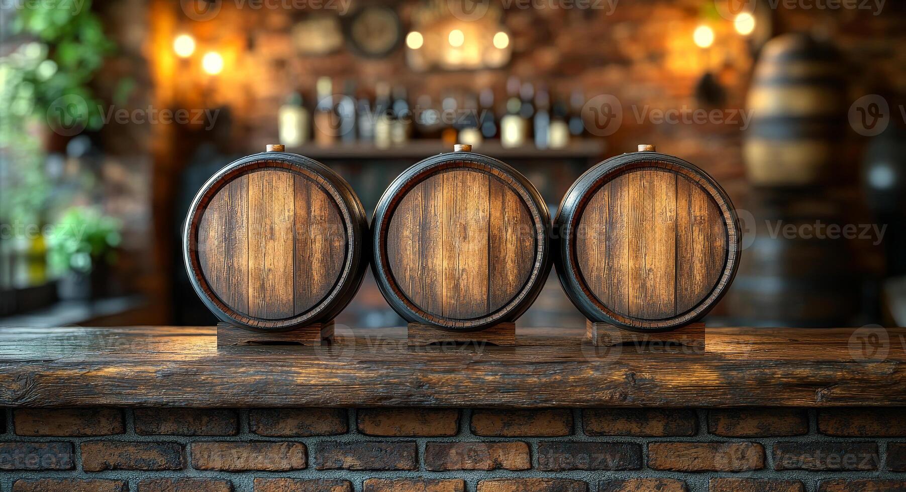 Three wooden barrels are on a wooden counter in front of a brick wall. The barrels are empty and the counter is made of wood photo