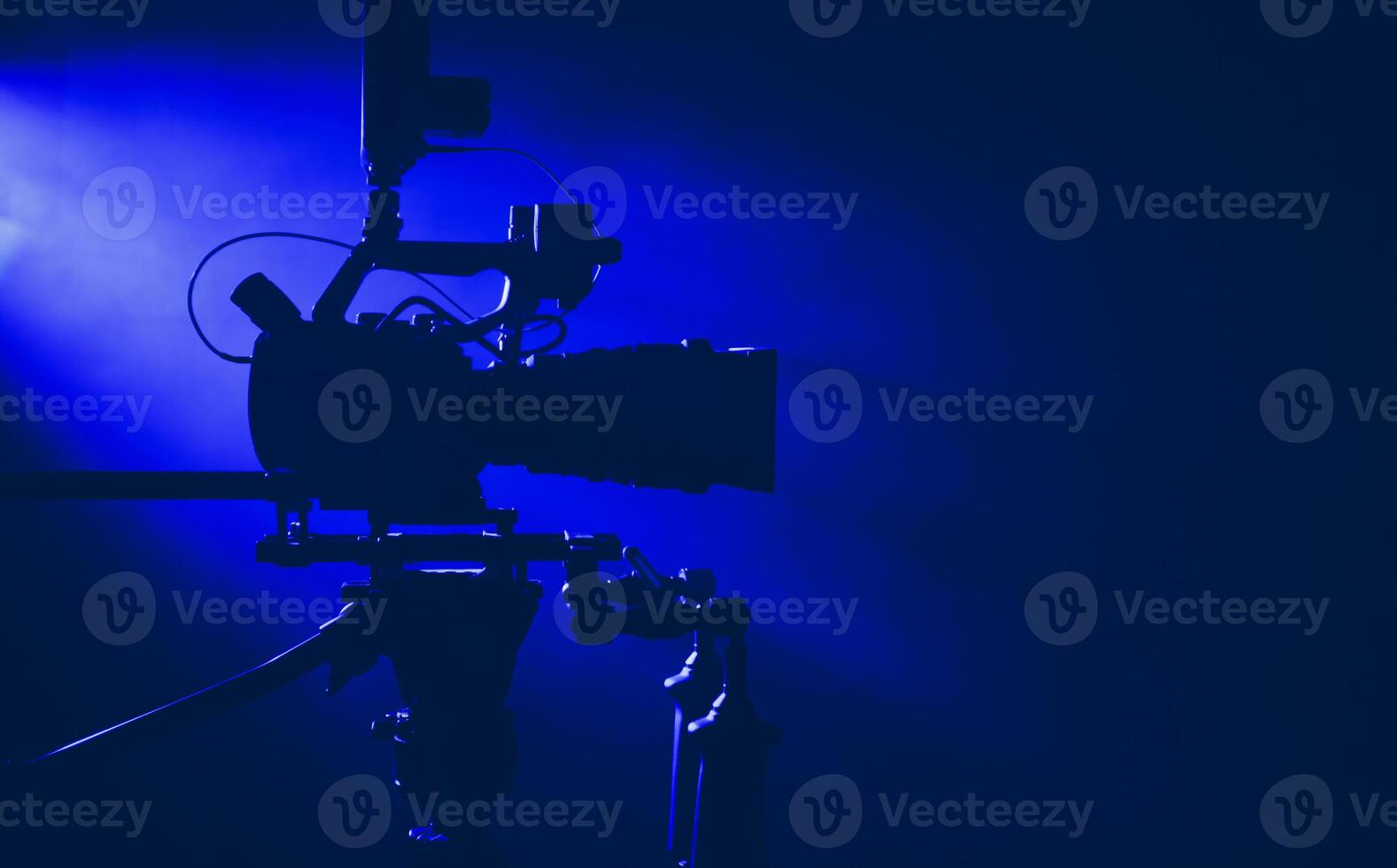 Camera Setup in a Dimly Lit Studio With Blue Lighting for a Film Project photo
