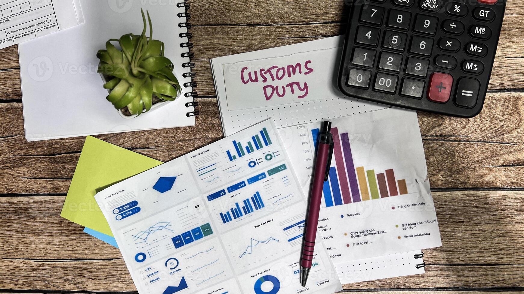 Concept of Customs Duty write on sticky notes isolated on Wooden Table. photo