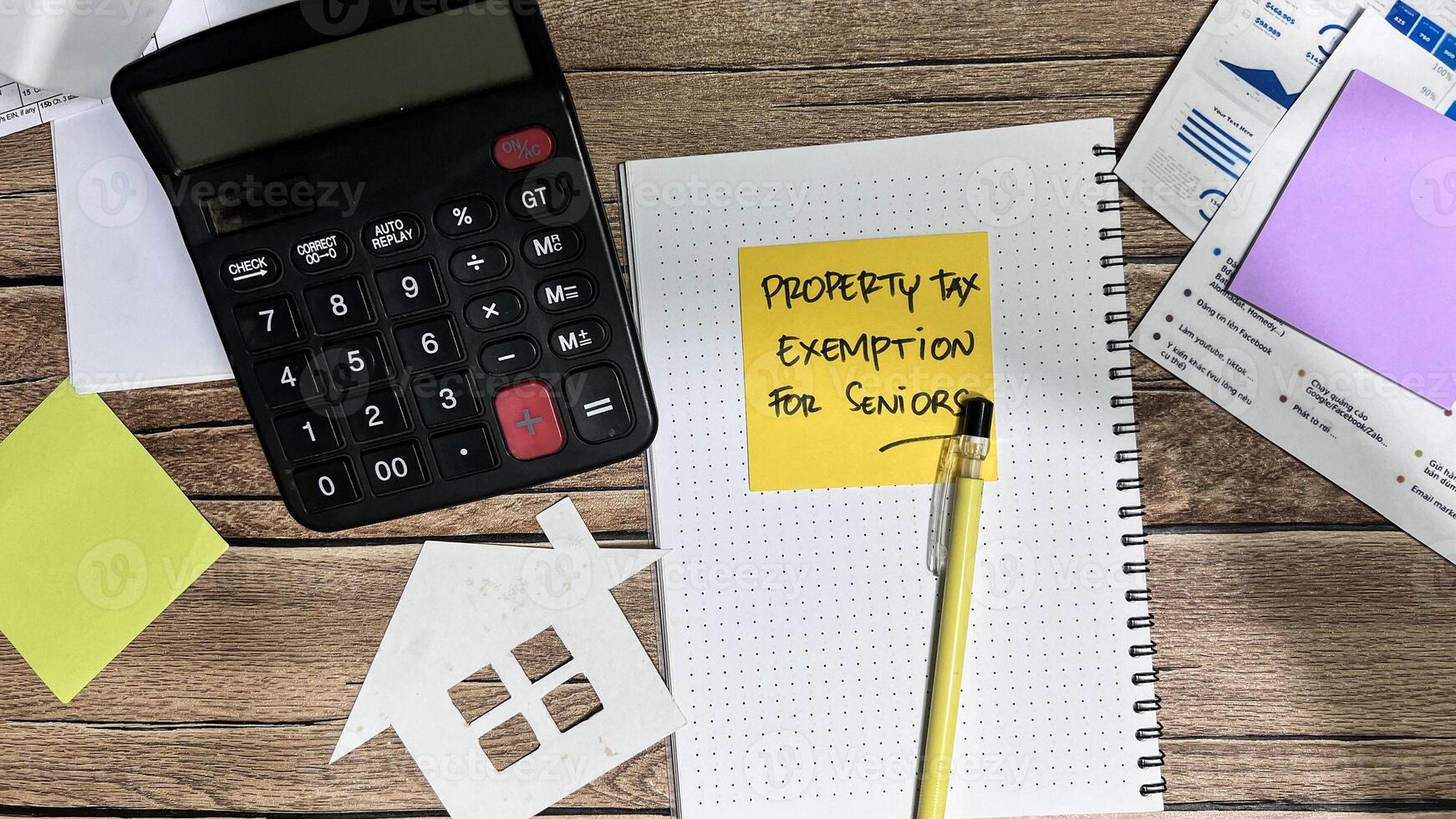 Concept of Property Tax Exemption For Seniors write on book isolated on Wooden Table. photo