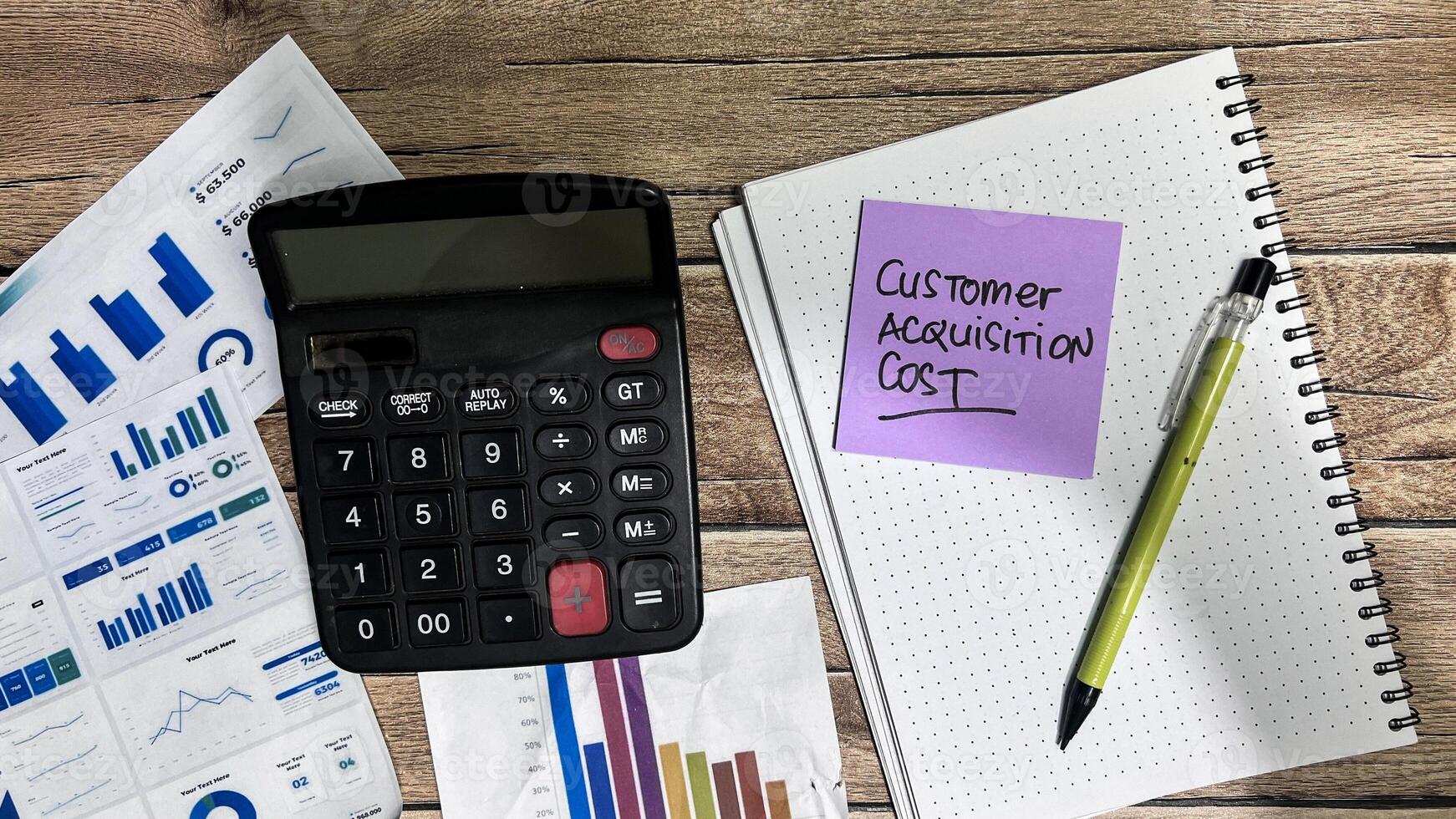 Concept of Customer Acquisition Cost write on sticky notes isolated on Wooden Table. photo