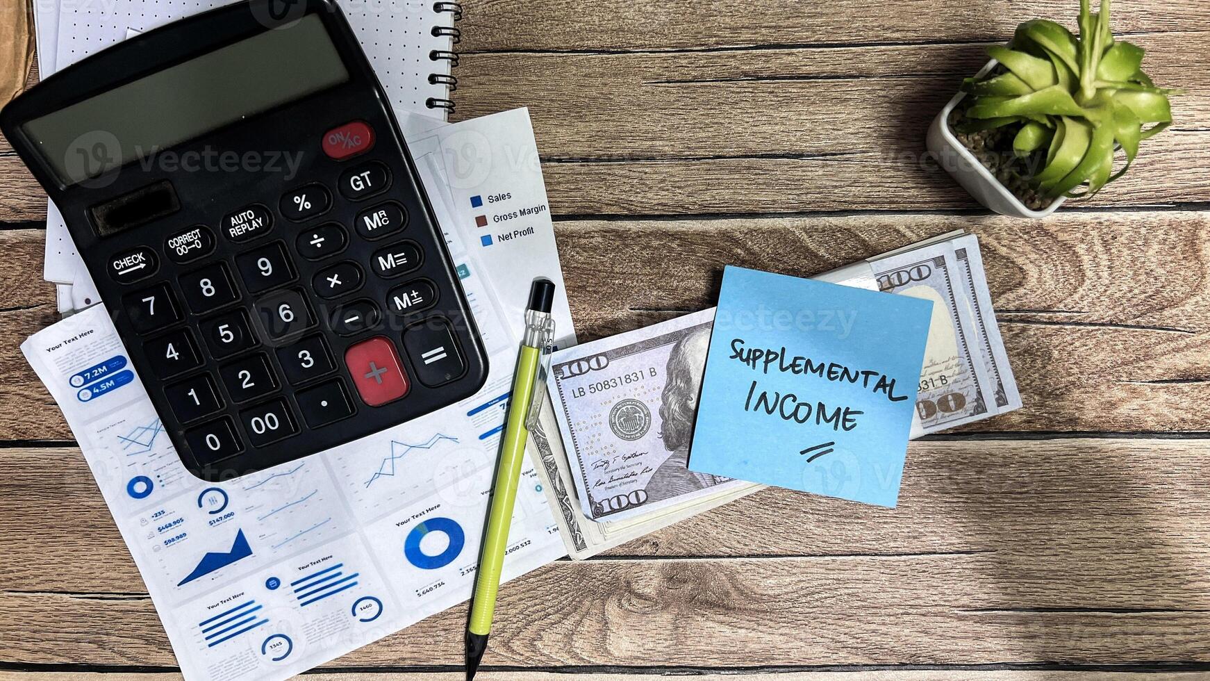 Concept of Supplemental Income write on sticky notes isolated on Wooden Table. photo