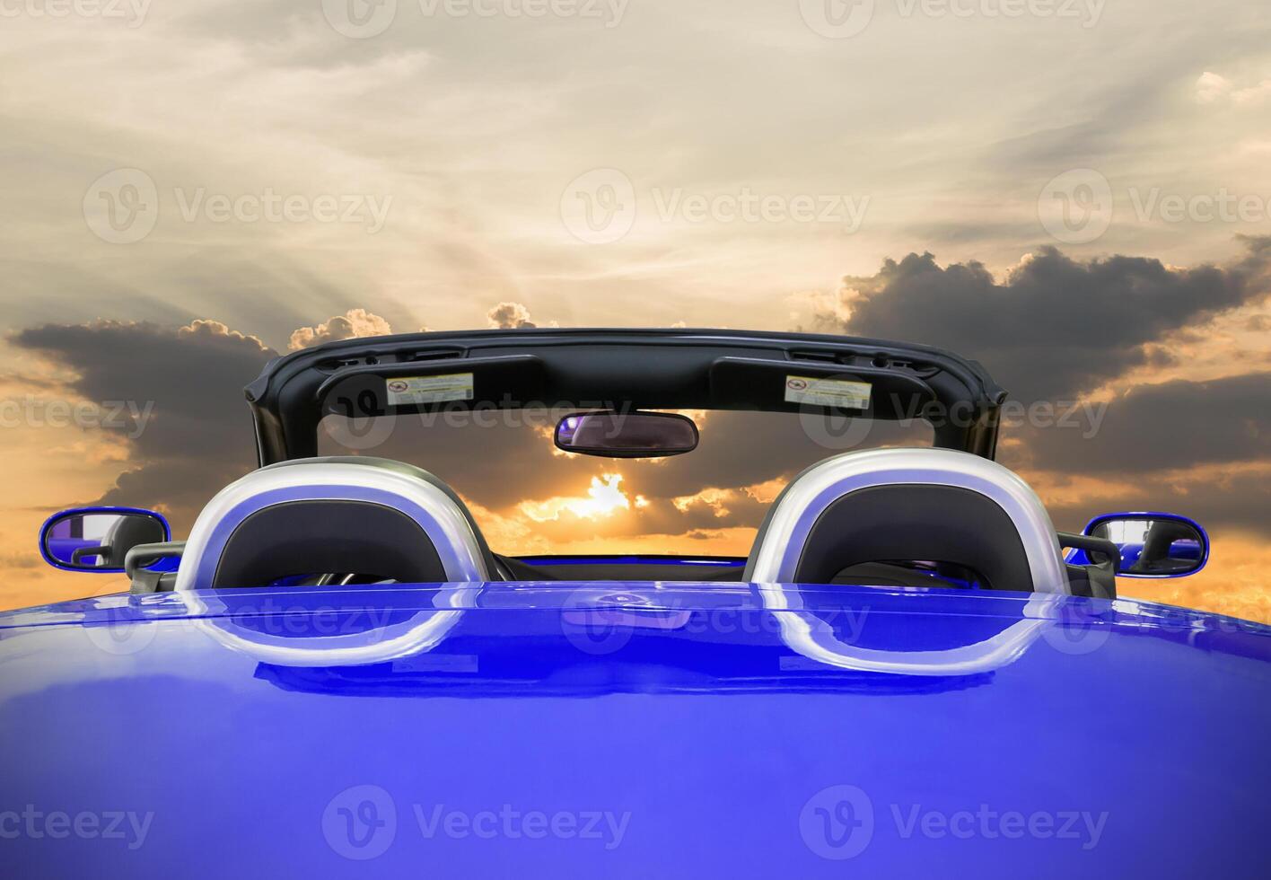 The blue car with sunset photo