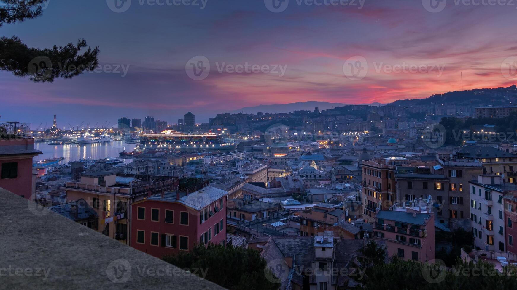 View of the port of Genoa at sunset from Spianata Castelletto, Italy. photo