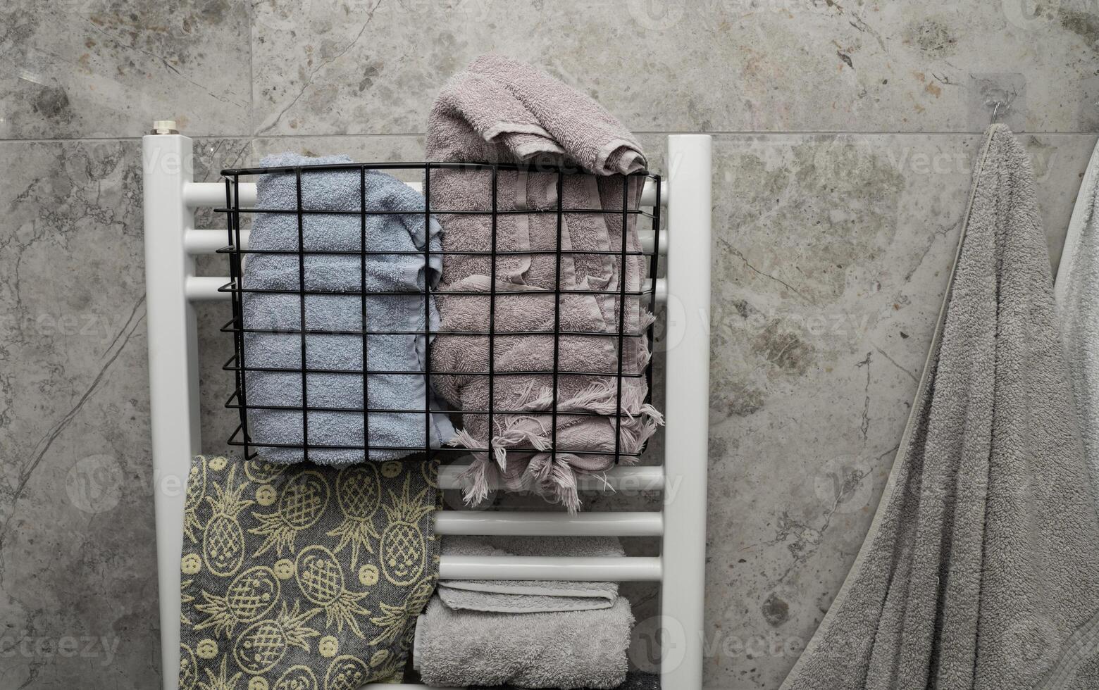 A towel rack with towels and towels hanging on it photo