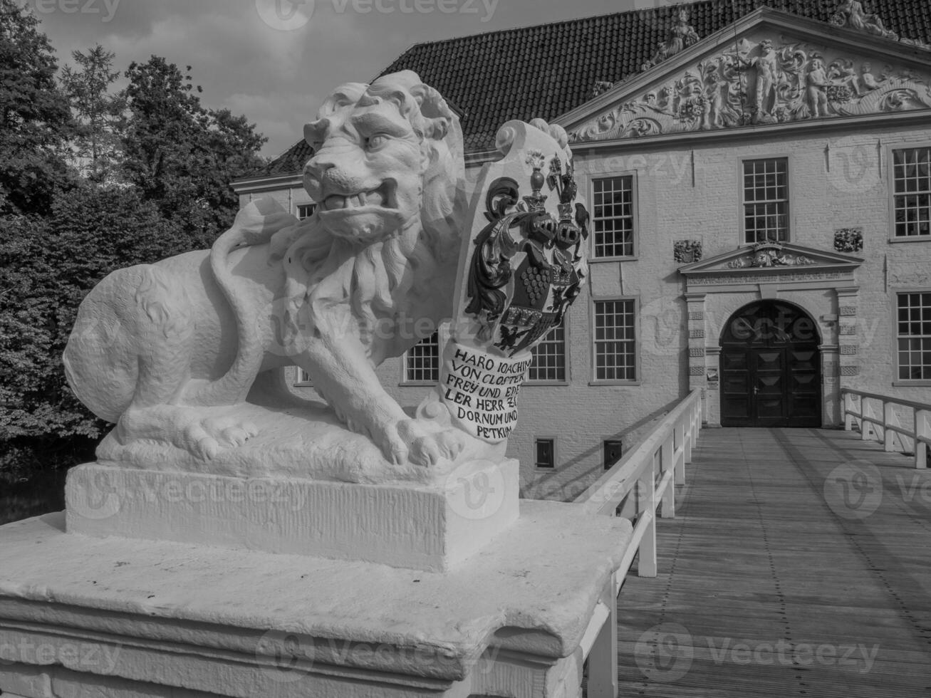 A statue of a lion in front of a building photo
