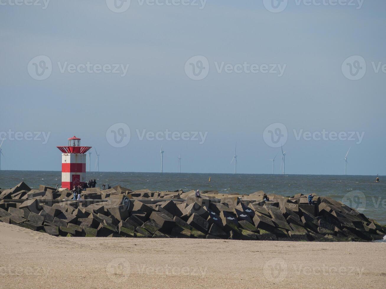 A large rock wall at the harbor photo