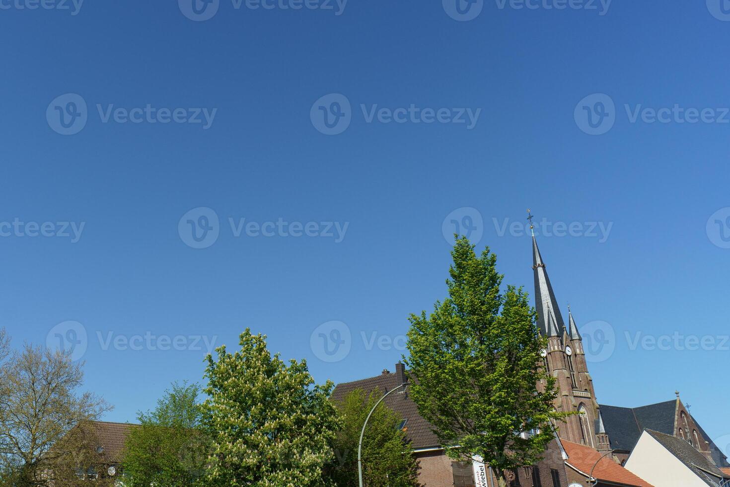 A church with a steeple at weseke photo
