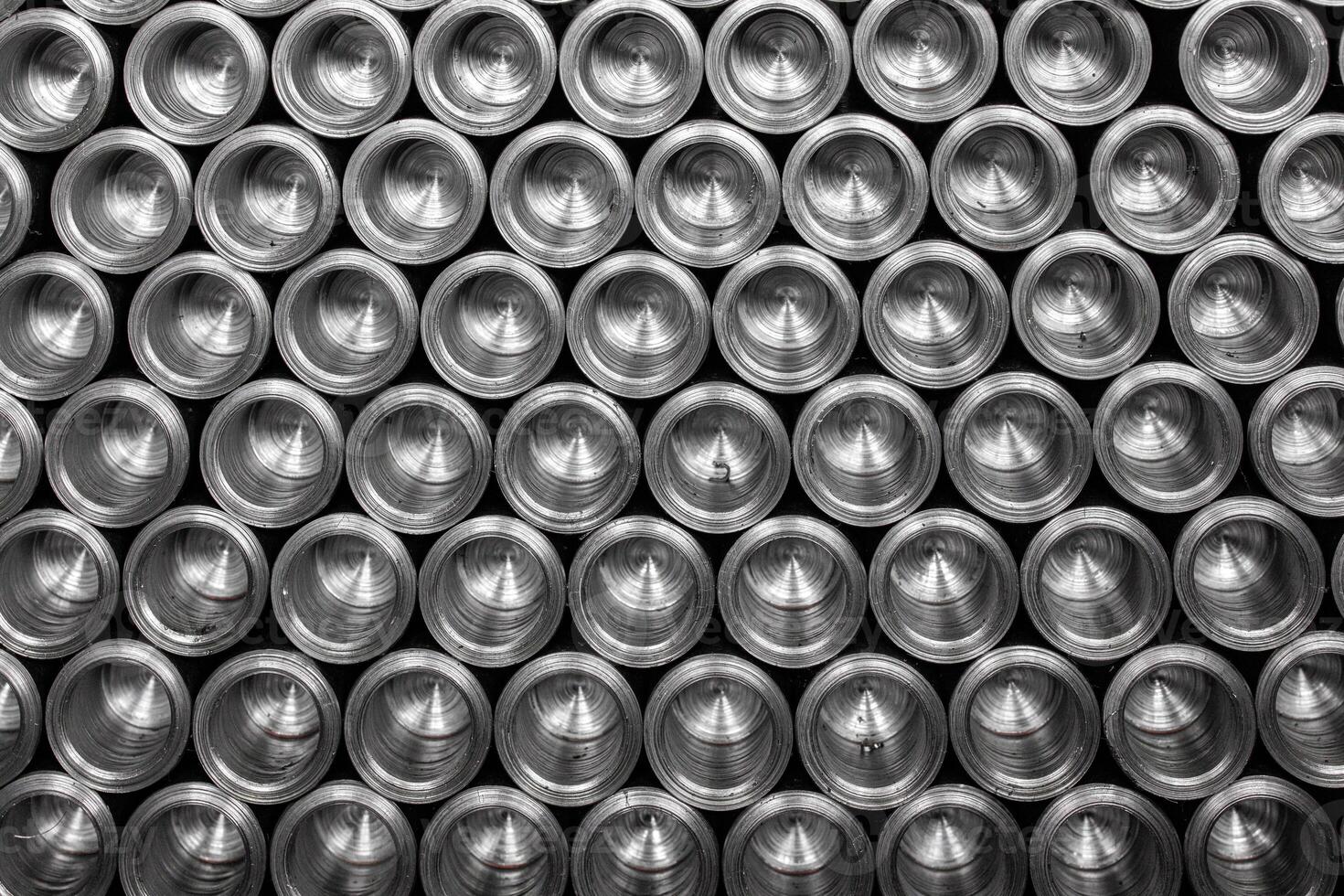 A vibrant tower of sleek aluminum cans glimmers under soft lighting, showcasing an array of colors that dance together. Each can, perfectly stacked photo