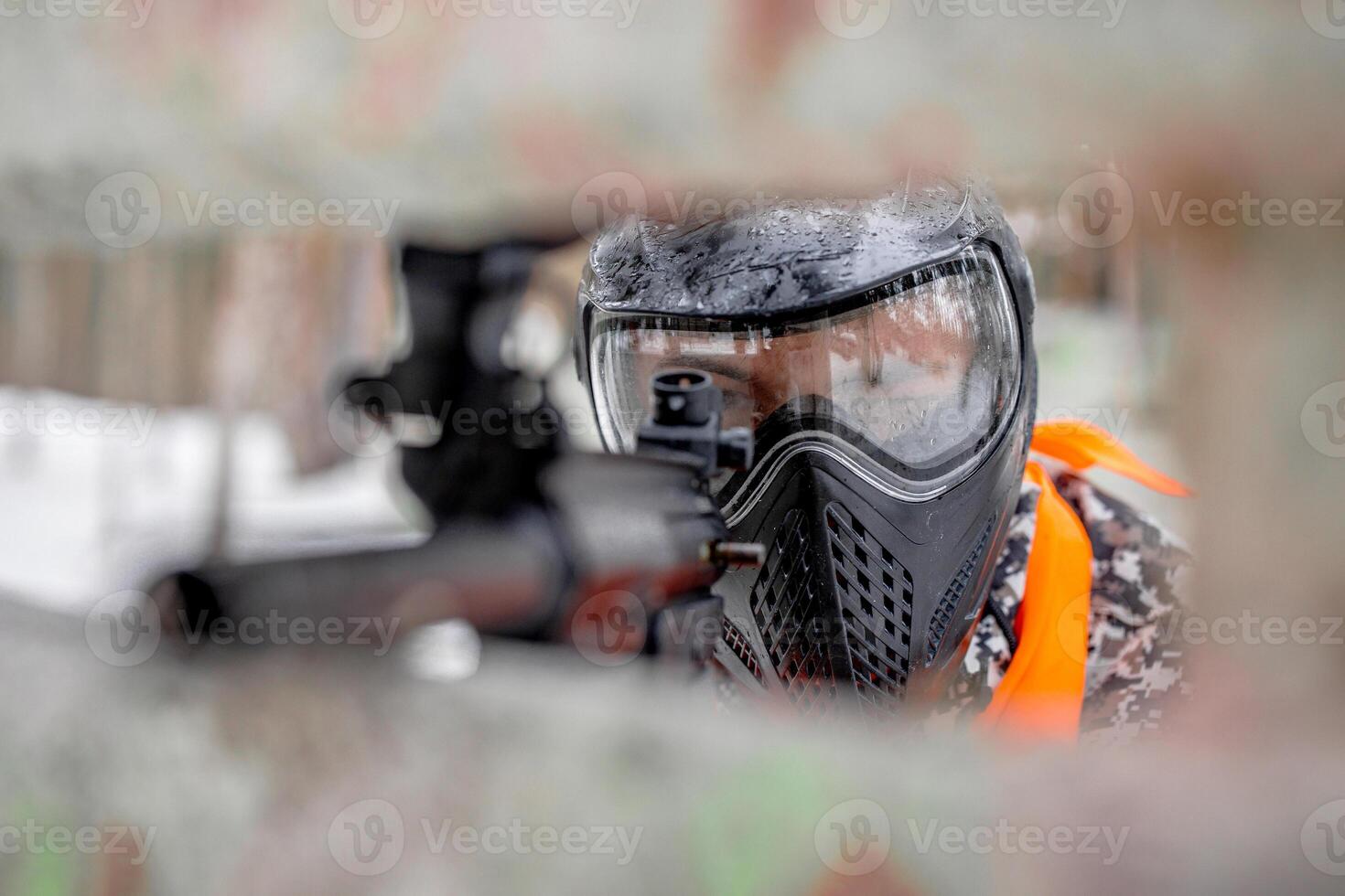 Locked and Loaded A Stealthy Aiming Moment in the Heat of Paintball Battle photo