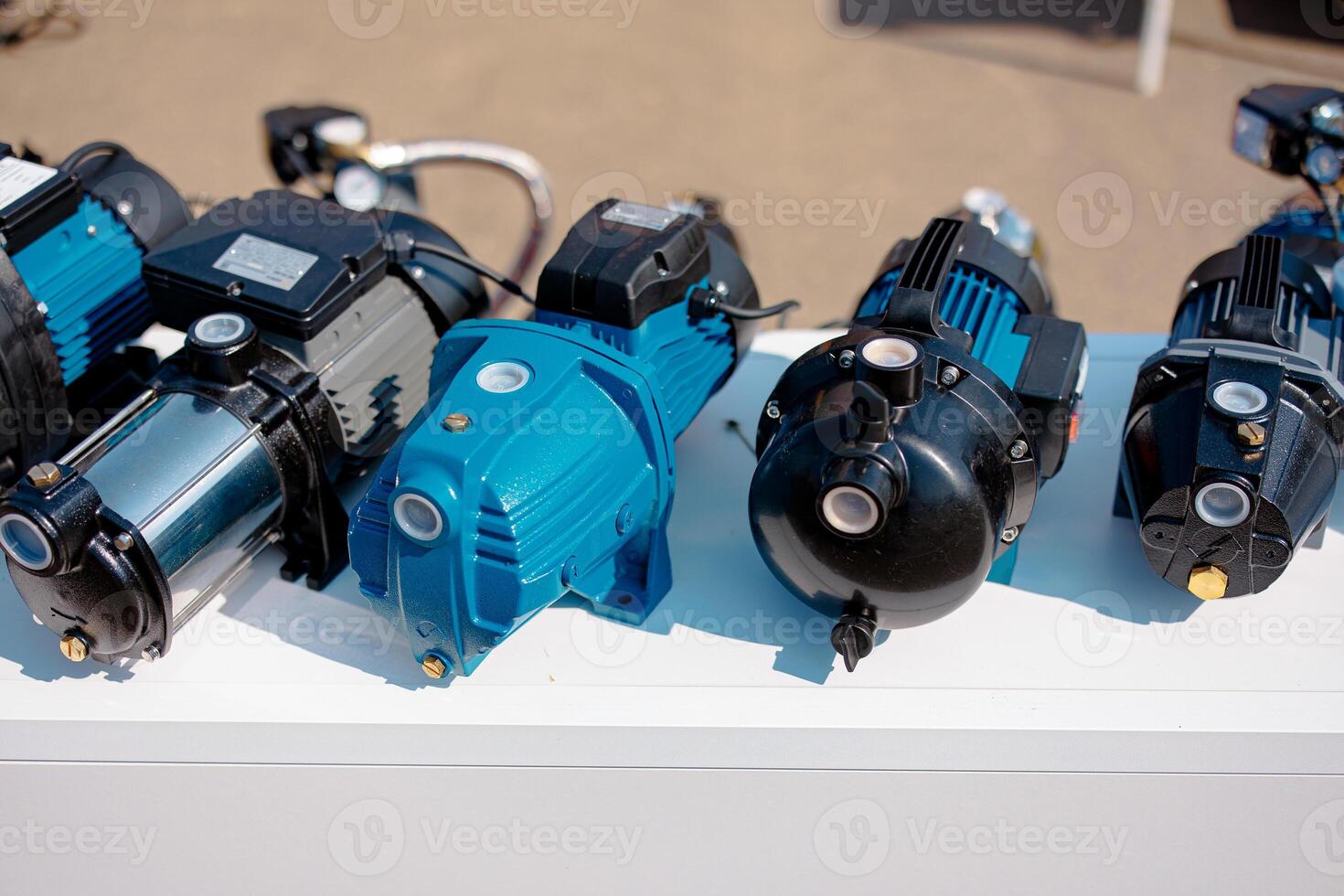 Array of Vibrant Water Pumps A Colorful Showcase of Functional Art in an Industrial Setting, Highlighting Design and Utility in Perfect Harmony. photo