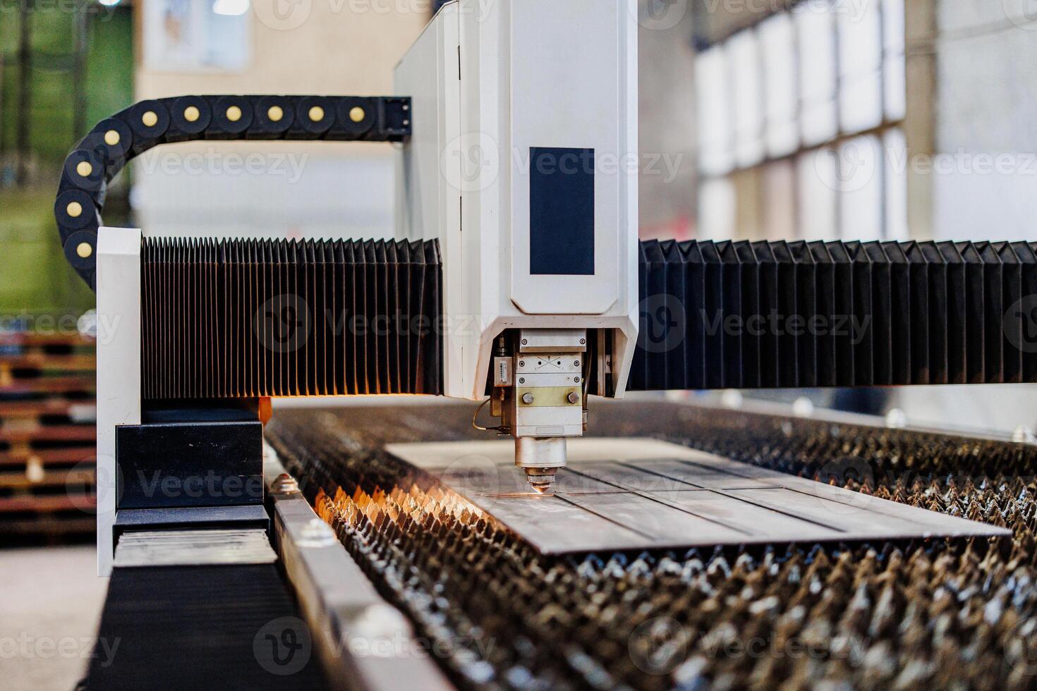 Precision in Motion A Laser Cutting Machine Sculpting Metal with Artistry and Accuracy, Creating Intricate Designs in Real-Time. photo