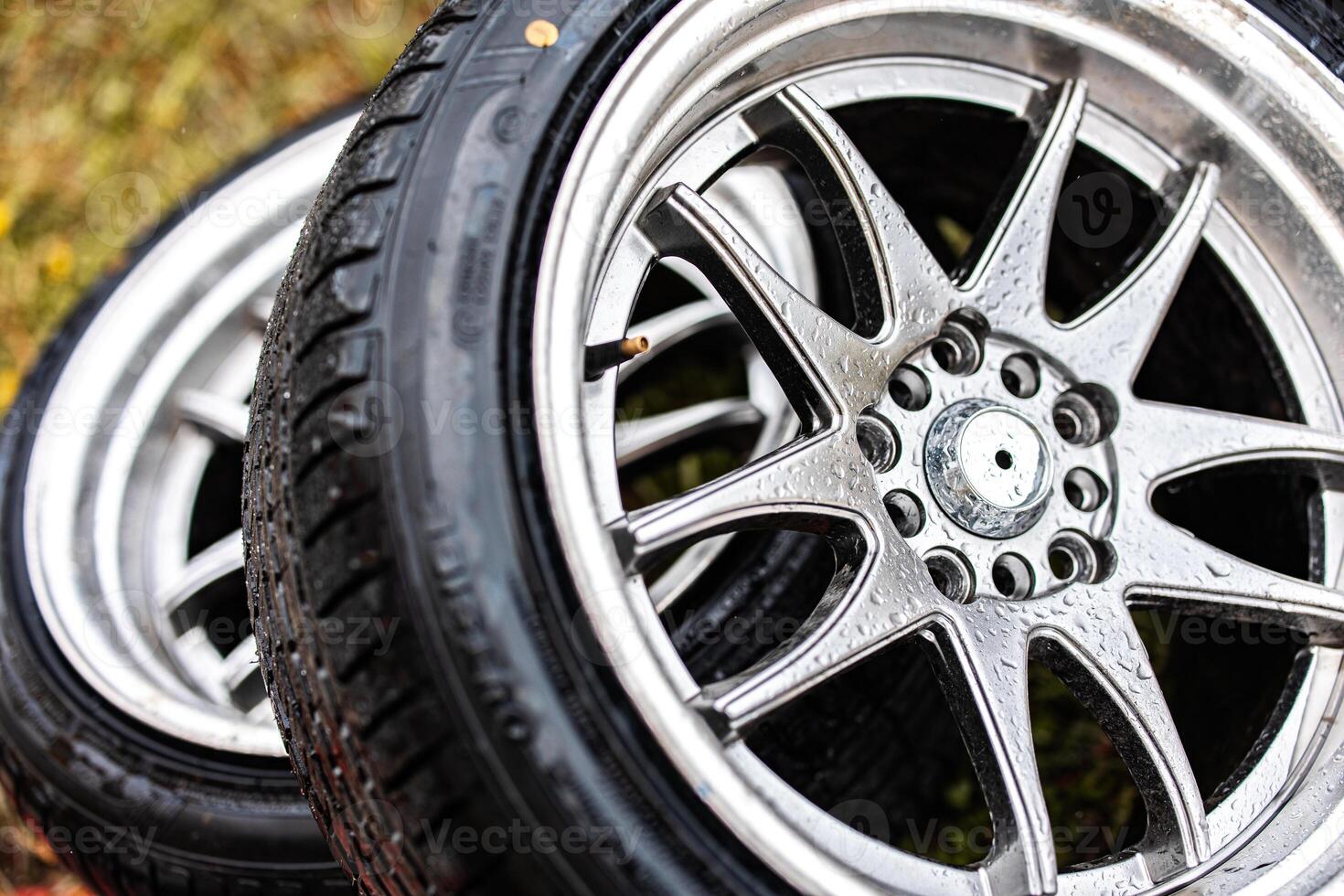 Shimmering Alloy Wheels Embrace Rugged Tires A Fusion of Strength and Style Showcasing Versatility on All Terrains. photo