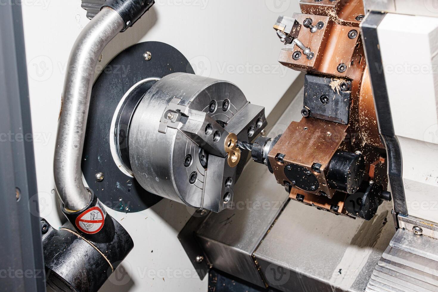 Precision Crafting in Motion A CNC Lathe Machine Carves Perfection with Spinning Metal and Robotic Precision. photo