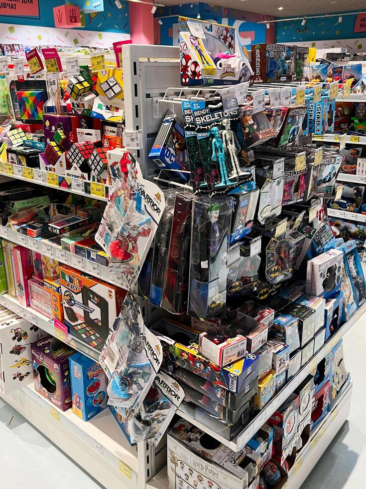 Kyiv, Ukraine - November 20, 2024 Vibrant toy store aisle filled with colorful games and puzzles photo